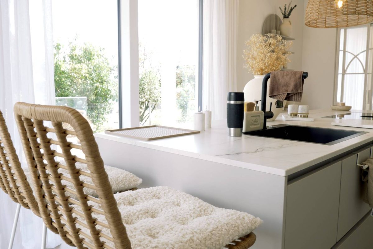 a kitchen with a white countertop and a white counter